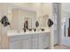 Bathroom featuring a double vanity with gray cabinets, a large mirror, and modern fixtures for a sleek look at 2555 Hampton Rd # 7304, Henderson, NV 89052