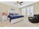 Calm bedroom featuring a ceiling fan, shuttered windows, a cozy armchair, and a comfortable bed at 2555 Hampton Rd # 7304, Henderson, NV 89052