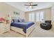 Inviting bedroom features a comfy chair, and a large window with shutter-style blinds at 2555 Hampton Rd # 7304, Henderson, NV 89052