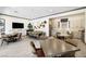 Bright community room with dining tables, a TV, and a full kitchen with stainless appliances at 2555 Hampton Rd # 7304, Henderson, NV 89052