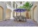 Charming courtyard with outdoor dining under large umbrellas at 2555 Hampton Rd # 7304, Henderson, NV 89052