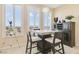 Cozy dining area with a modern table, seating, and large windows offering scenic views at 2555 Hampton Rd # 7304, Henderson, NV 89052