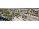 View of condo community with lush landscaping and convenient garage parking at 2555 Hampton Rd # 7304, Henderson, NV 89052