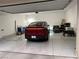 Garage showcasing a clean, epoxy floor, storage and a dark red car at 2555 Hampton Rd # 7304, Henderson, NV 89052