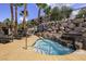 Serene hot tub surrounded by lush landscaping and lounge seating at 2555 Hampton Rd # 7304, Henderson, NV 89052