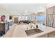 Bright open-concept kitchen with stainless steel appliances and views of the living room and outdoor patio at 2555 Hampton Rd # 7304, Henderson, NV 89052