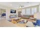 Bright living room featuring a sectional sofa, modern decor, and large windows with plantation shutters at 2555 Hampton Rd # 7304, Henderson, NV 89052