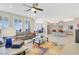 Open concept living room featuring a sectional sofa, leading to a modern kitchen with stainless steel appliances at 2555 Hampton Rd # 7304, Henderson, NV 89052