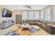 Contemporary living room with a large sectional sofa and bright natural light at 2555 Hampton Rd # 7304, Henderson, NV 89052