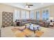 Inviting living room featuring a comfortable sectional sofa, stylish decor, and bright natural light at 2555 Hampton Rd # 7304, Henderson, NV 89052