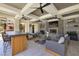 Inviting covered patio with comfortable seating, a fireplace, and outdoor kitchen area at 2555 Hampton Rd # 7304, Henderson, NV 89052