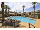 Resort style pool featuring lounge chairs, palm trees and outdoor shade at 2555 Hampton Rd # 7304, Henderson, NV 89052