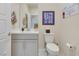 Cozy powder room with updated sink, toilet, mirror, and decor at 2555 Hampton Rd # 7304, Henderson, NV 89052