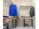 Organized walk-in closet with shelving, shoe racks, and clothing rods at 2555 Hampton Rd # 7304, Henderson, NV 89052
