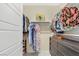 Organized walk-in closet with custom shelving, hanging rods, and ample storage for clothes and accessories at 2555 Hampton Rd # 7304, Henderson, NV 89052