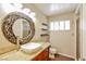 Bathroom with a vessel sink, a shower with glass enclosure, and wood-look flooring at 2614 Capistrano Ave, Las Vegas, NV 89121