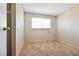 Carpeted bedroom with a large window at 2614 Capistrano Ave, Las Vegas, NV 89121