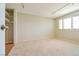 Carpeted bedroom featuring a closet with built-in shelving and a large window at 2614 Capistrano Ave, Las Vegas, NV 89121