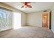 Spacious carpeted bedroom with sliding glass doors providing ample natural light at 2614 Capistrano Ave, Las Vegas, NV 89121