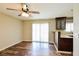 Cozy dining area with hardwood floors, a ceiling fan, and natural light at 2614 Capistrano Ave, Las Vegas, NV 89121