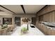 Modern kitchen with marble countertops, custom cabinets, and seamless access to the dining area at 2655 Juniper Branch St, Las Vegas, NV 89117