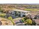 A modern, multi-story home in the desert with xeriscaping, a manicured front yard and views of desert and mountains at 2695 Ponte Vecchio Ter, Henderson, NV 89052