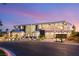Modern home exterior showcasing clean lines and professional landscaping under a colorful sky at 2695 Ponte Vecchio Ter, Henderson, NV 89052