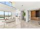 Open living space featuring a seamless indoor-outdoor transition, with views of the pool and landscape at 2695 Ponte Vecchio Ter, Henderson, NV 89052