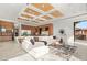 A spacious living room offers modern decor, hardwood floors, and access to the kitchen at 2695 Ponte Vecchio Ter, Henderson, NV 89052