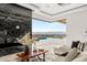 An elegant living room featuring a fireplace with marble accent wall and panoramic views at 2695 Ponte Vecchio Ter, Henderson, NV 89052