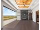 The main bedroom features wood ceiling, fireplace, shelves, and mountain view through glass doors at 2695 Ponte Vecchio Ter, Henderson, NV 89052