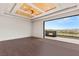A stylish main bedroom suite offers a hardwood floor and a mountain view at 2695 Ponte Vecchio Ter, Henderson, NV 89052