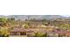 A scenic view of a residential neighborhood, with red-tiled roofs and desert landscaping and mountains in the background at 2695 Ponte Vecchio Ter, Henderson, NV 89052