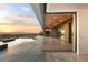 Expansive outdoor space with infinity pool, covered patio, and breathtaking sunset views at 2695 Ponte Vecchio Ter, Henderson, NV 89052