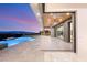 Infinity pool with stunning views of mountains and city lights, with an outdoor entertainment space at 2695 Ponte Vecchio Ter, Henderson, NV 89052