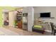 The kitchenette features stainless steel appliances, wood cabinets and shelving, with laminate floors at 30 Strada Di Villaggio # 429, Henderson, NV 89011