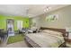 Bright living space with green accent wall and a sliding glass door to private balcony at 30 Strada Di Villaggio # 429, Henderson, NV 89011