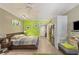 Open floor plan offers a kitchen, dining, and living area with a bright green accent wall at 30 Strada Di Villaggio # 429, Henderson, NV 89011