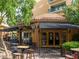 Charming restaurant exterior with outdoor seating and a lovely tree-lined street at 30 Strada Di Villaggio # 429, Henderson, NV 89011