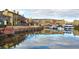 Scenic view of waterfront property with colorful buildings reflected in the calm water at 30 Strada Di Villaggio # 429, Henderson, NV 89011
