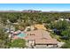 Expansive backyard featuring a sparkling swimming pool, covered patio, and lush greenery in a desirable location at 3104 Conners Dr, Las Vegas, NV 89107
