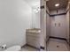 Tiled bathroom featuring a shower stall with glass door and a single sink vanity at 3104 Conners Dr, Las Vegas, NV 89107
