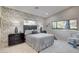 Well-designed bedroom with floral wallpaper, modern furniture, and natural light at 3104 Conners Dr, Las Vegas, NV 89107
