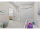 Spacious Bedroom featuring a crib, sitting area, closet, and access to an en-suite bathroom at 3104 Conners Dr, Las Vegas, NV 89107