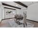 Bright dining room with wood beam ceiling, modern decor, and large windows at 3104 Conners Dr, Las Vegas, NV 89107