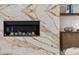 Close-up of a modern fireplace with marble surround and built-in shelving at 3104 Conners Dr, Las Vegas, NV 89107