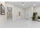 Bright foyer featuring white tile floors, modern lighting, and elegant decor at 3104 Conners Dr, Las Vegas, NV 89107