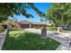 Charming single-story brick home with lush landscaping, large driveway, and inviting curb appeal at 3104 Conners Dr, Las Vegas, NV 89107