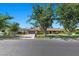 Charming brick home featuring a well-kept lawn, mature trees, and inviting curb appeal, offering suburban tranquility at 3104 Conners Dr, Las Vegas, NV 89107