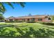 Charming single-story brick home with a manicured lawn and mature landscaping at 3104 Conners Dr, Las Vegas, NV 89107